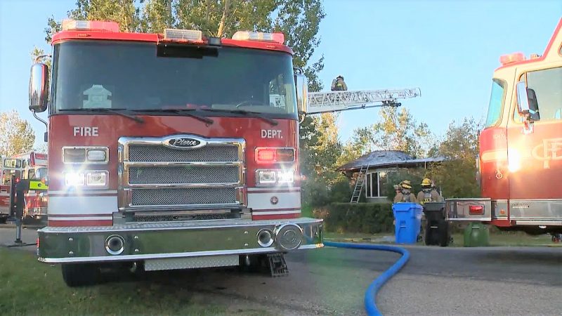 The Calgary Fire Department responds to a house fire in the 10000 block of 86 Street Southeast on Thursday, Aug. 12, 2021.