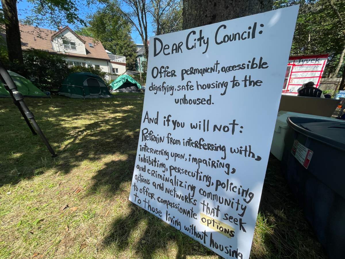 A sign at Meagher Park calling on the city to provide better housing options.