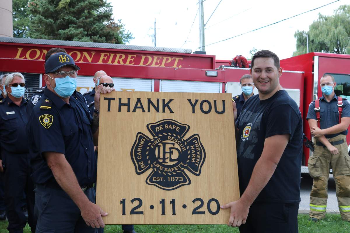 Jacob Hurl holding up a handmade plaque he made to thank the firefighters who saved his life during the Dec. 11, 2020 partial building collapse 555 Teeple Terrace in London Ont. on August 30, 2021