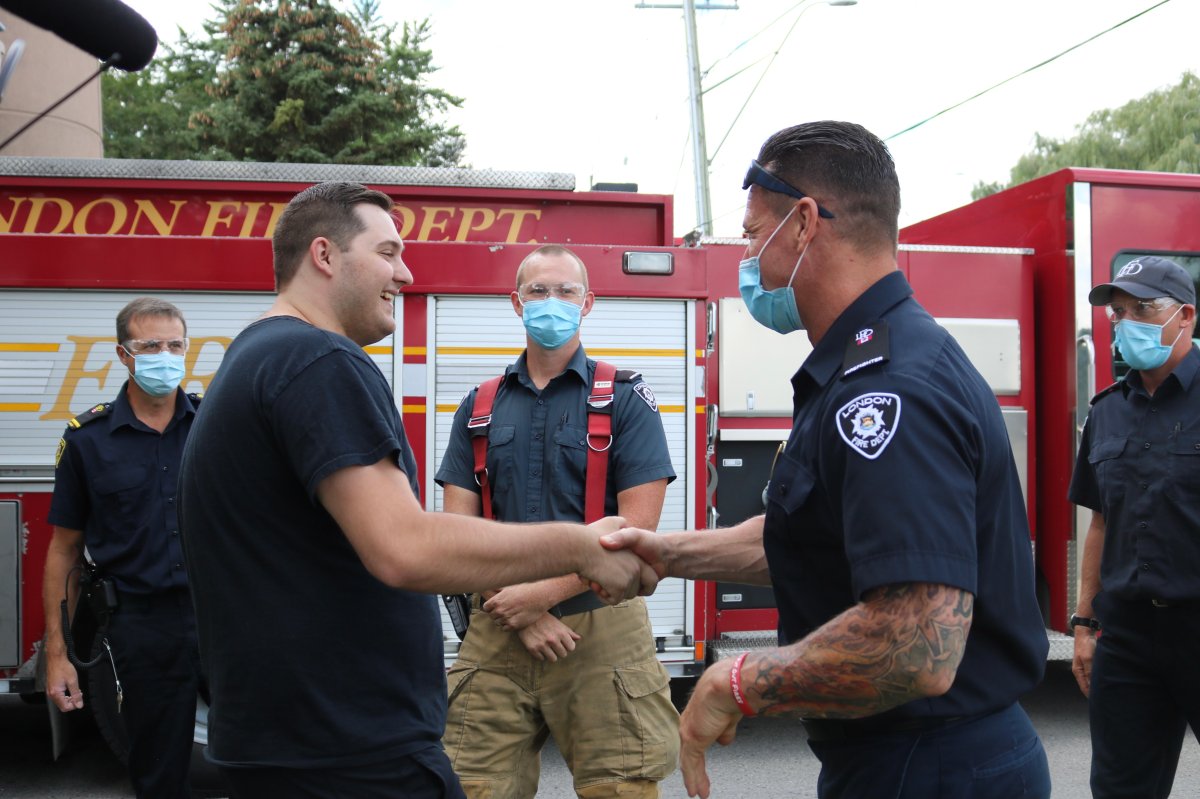 Jacob Hurl shaking the hands of some of the firefighter at Station 3 who helped save his life during the Dec. 11, 2020 partial building collapse 555 Teeple Terrace in London Ont. on August 30, 2021 .