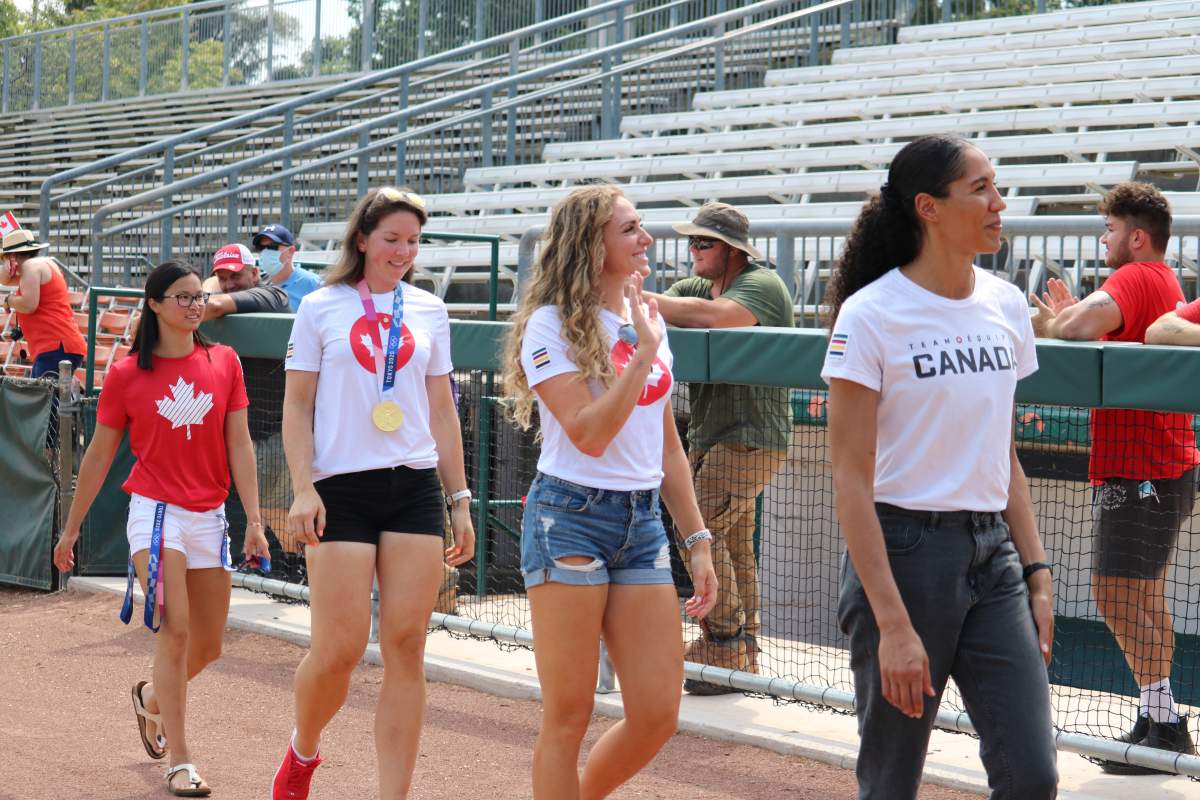 (Left to right) Maggie Mac Neil, Susanne Grainger, Jen Martins, and Miranda Ayim waving at crowd of supporters at the London Olympic celebration at Labatt Park on Saturday, August 28, 2021