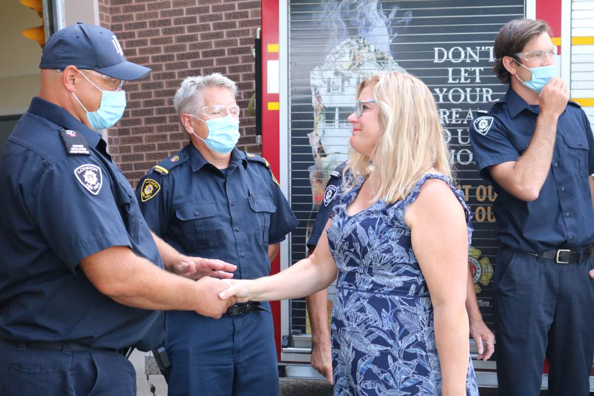 Mary Keetch thanking some of the firefighters who saved her son Jacob Hurl’s life during the partial building collapse 555 Teeple Terrace in London Ont. on August 30, 2021