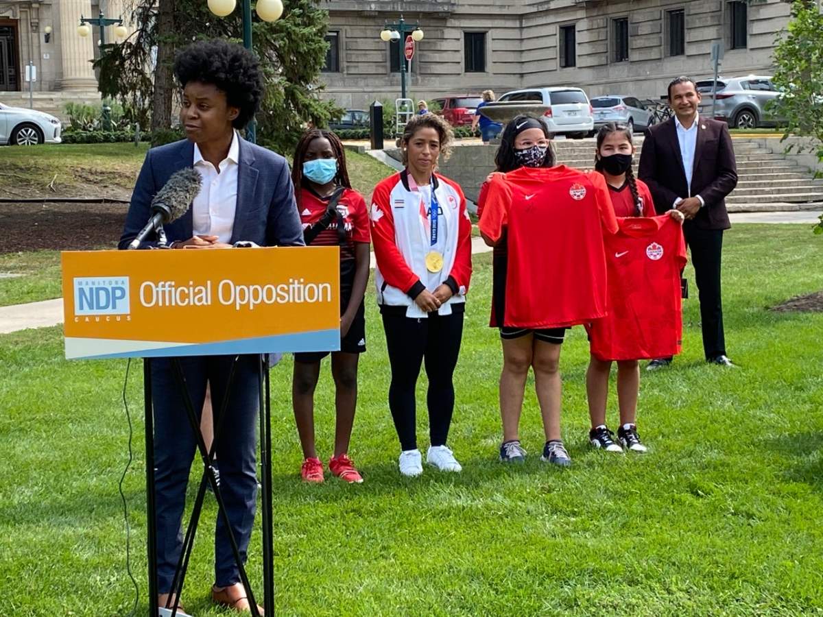 Uzoma Asagwara, NDP MLA for Union Station, addresses a crowd outside the Manitoba Legislative building, calling on the provincial government to invest in sports for women, girls and gender-diverse peoples.