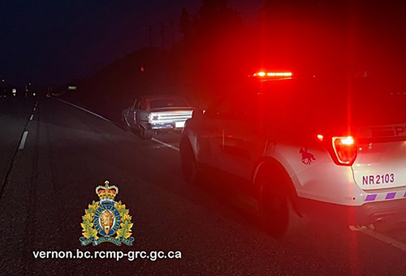 A photo of a stopped vehicle with an RCMP vehicle parked behind it.