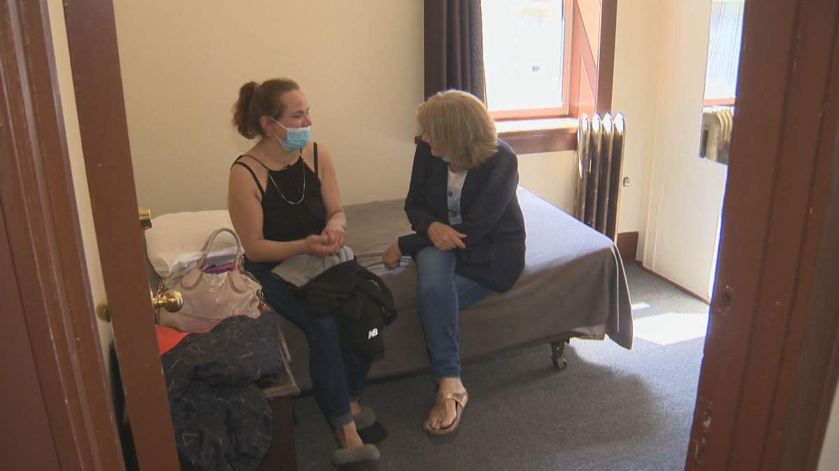 Lauren Munro (left) and St. Boniface Street Links founder and executive director Marion Willis in Munro’s new place for the first time. The night before, Munro had slept outside.