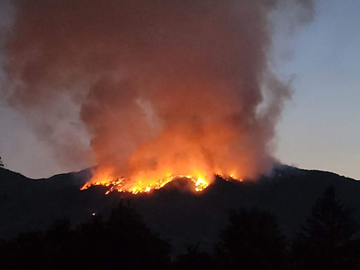 Sandy Berney submitted this photo of the Skaha Creek wildfire west of Penticton, B.C., after it crested the ridge on Sunday, Aug. 29, 2021.