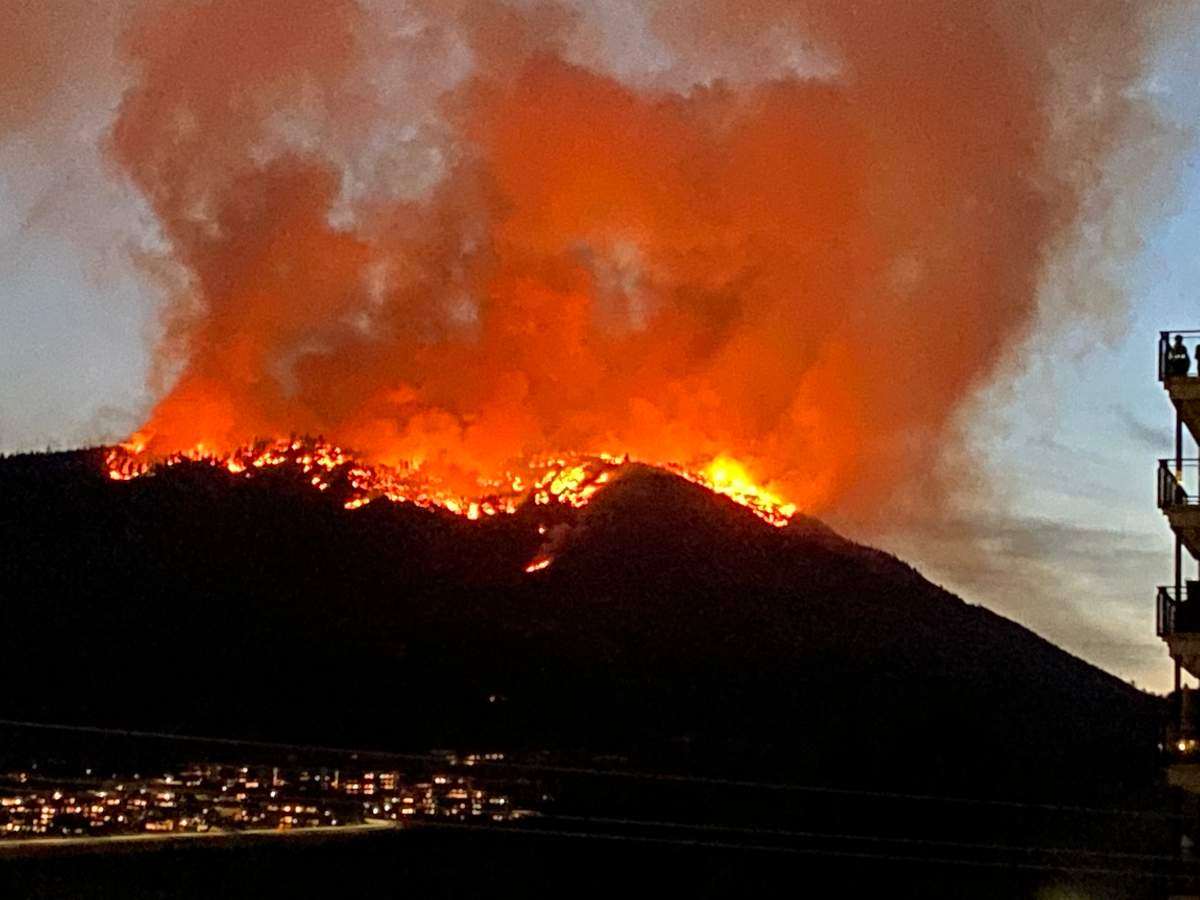 Sylvia Thompson snapped this photo of the Skaha Creek wildfire as it marched down the hillside west of Penticton, B.C., on Sunday, Aug. 29, 2021.