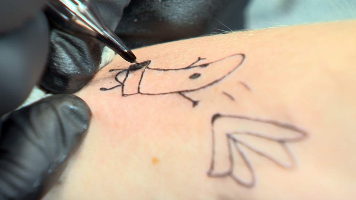 Tattoo artists say demand is skyrocketing as pandemic restrictions lift.