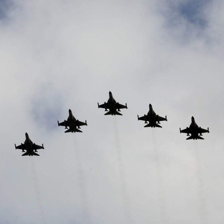 Taiwanese F-16 fighter jets fly in formation during an inauguration ceremony in Taichung, Taiwan, Aug. 28, 2020(photo credit: REUTERS/ANN WANG)