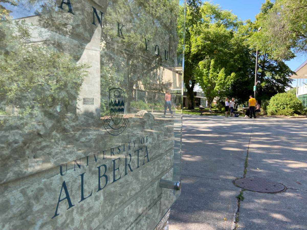 Students walk through the University of Alberta campus.