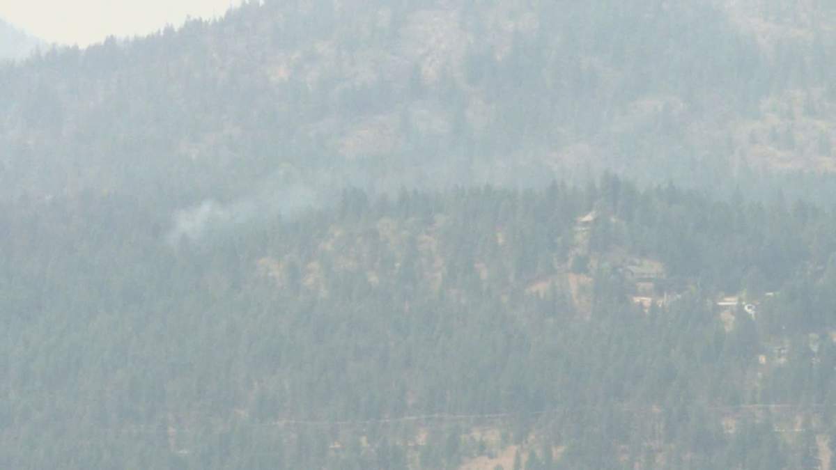 Smoke rises from the White Rock Lake wildfire. The City of Armstrong has rescinded an evacuation alert because of the wildfire, but noted the massive blaze will still be closely monitored.