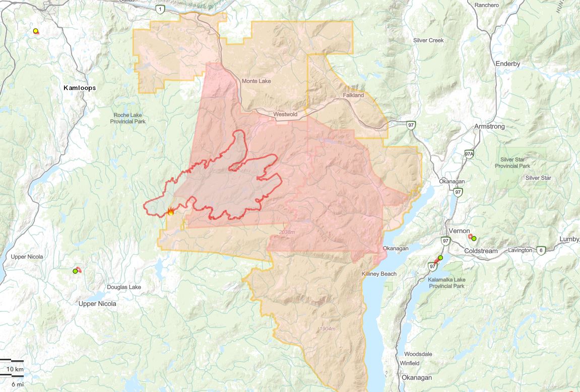 The dark red area shows the perimeter of the wildfire, while the red-shaded area is the evacuation order zone, and the orange-shaded area is the evacuation alert zone.