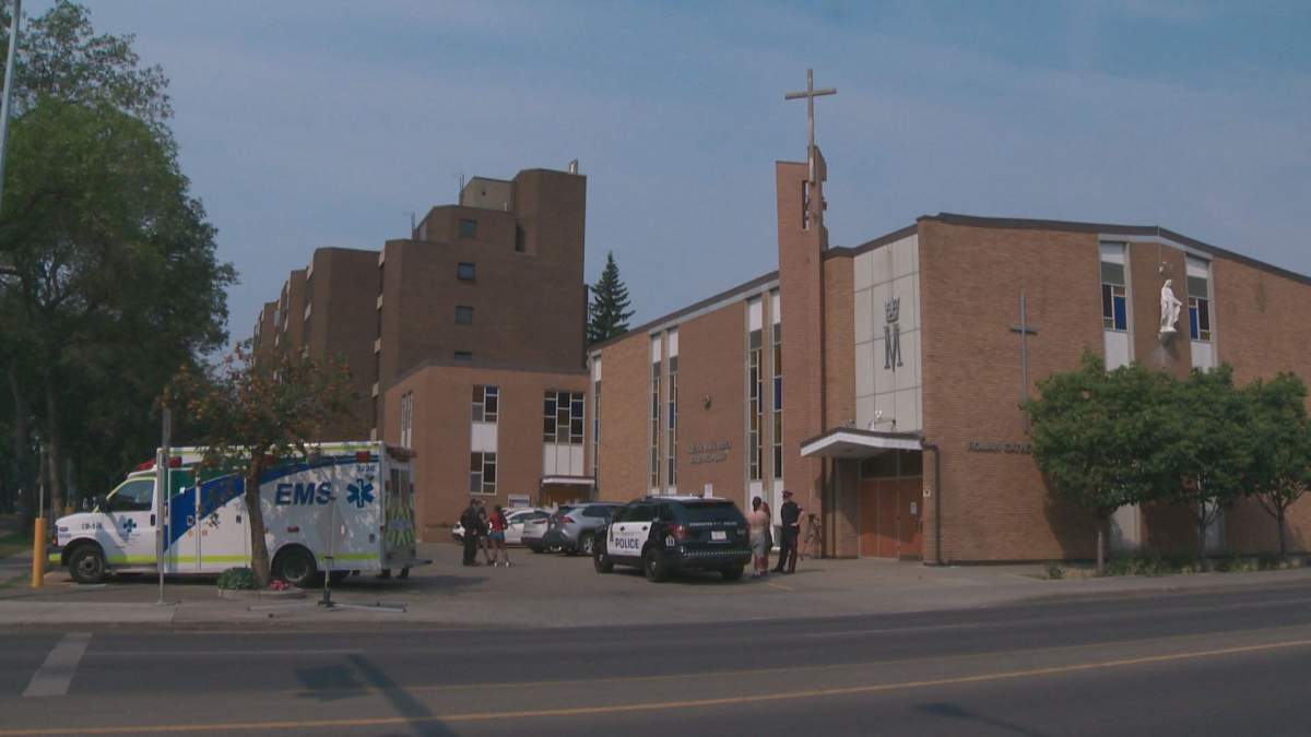 A woman says she was hurt during a demonstration outside an Edmonton Catholic church August 15, 2021.