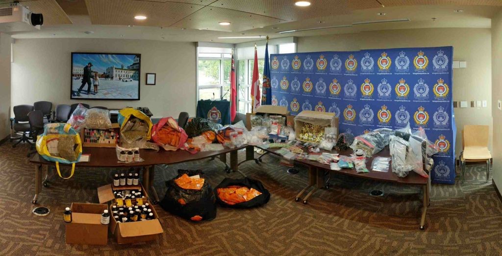 A cocaine trafficking investigation led Kingston police officer's to two homes last week, where they seized hundreds of thousands worth of drugs and cash, police say. 