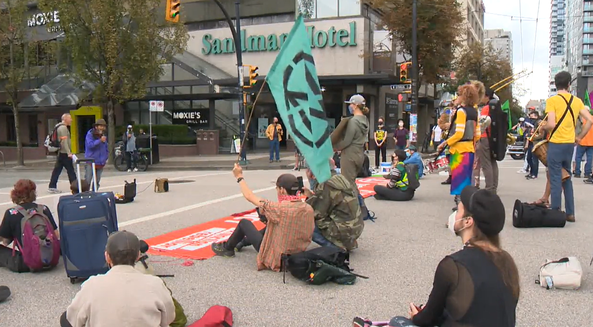 Extinction rebellion protesters occupy an intersection in Vancouver. 