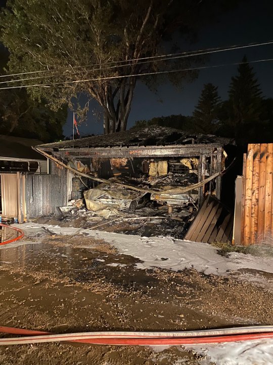 Regina fire crews battle two garage fires Saturday, 1 sent to hospital