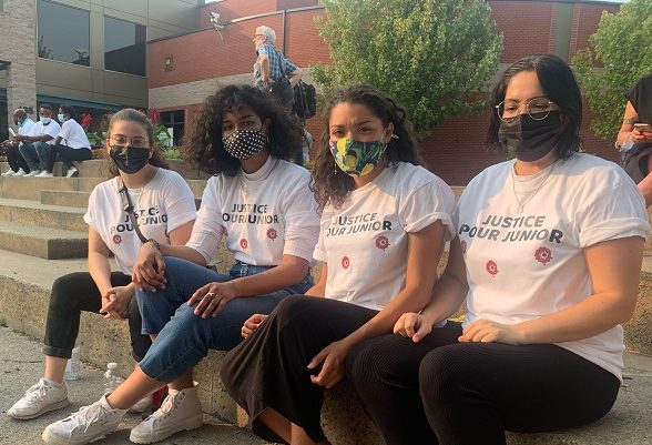 Attendees wear T-shirts that read “Justice pour Junior.” Olivia O’Malley/Global News