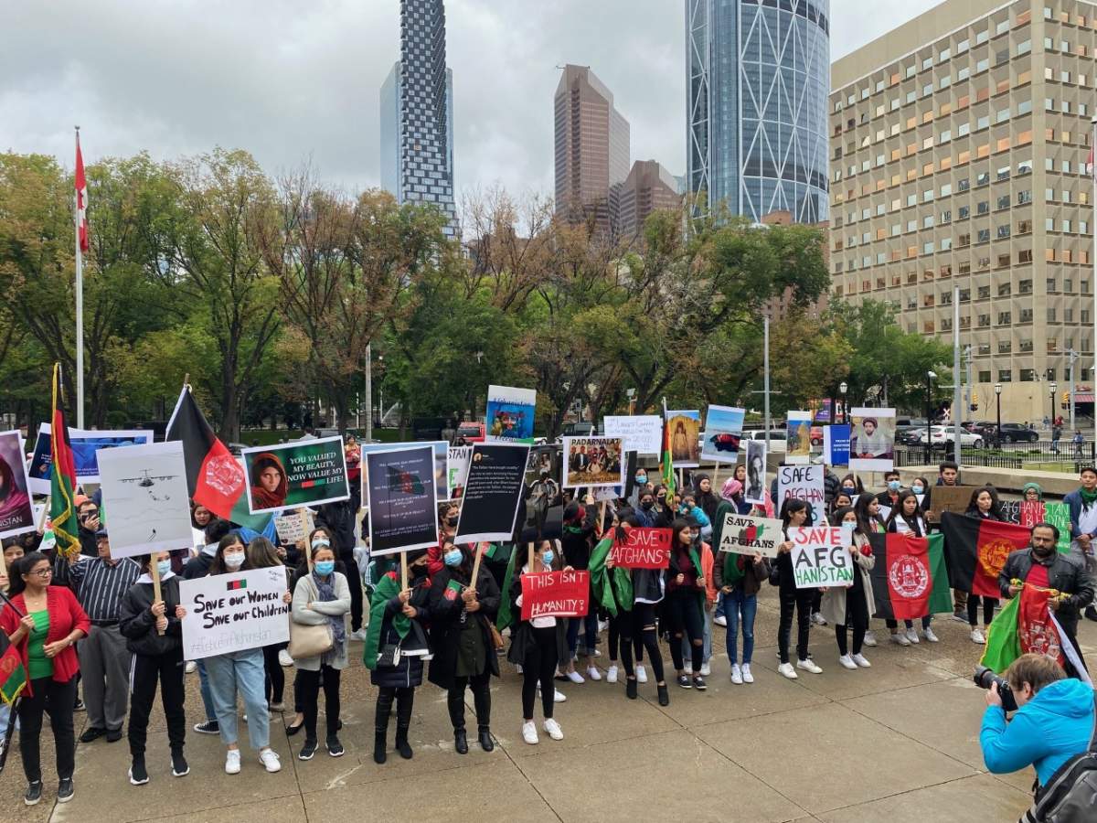 A protest raising awareness of the fragile humanitarian situation in Afghanistan is staged in front of Calgary City Hall on Aug. 19, 2021.