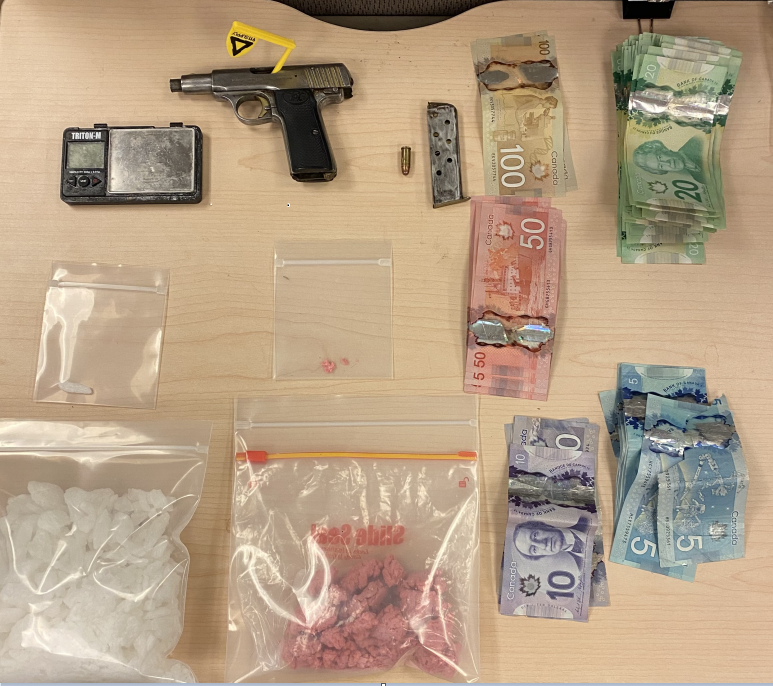 Kingston police arrest  two people on drug and weapons charges.