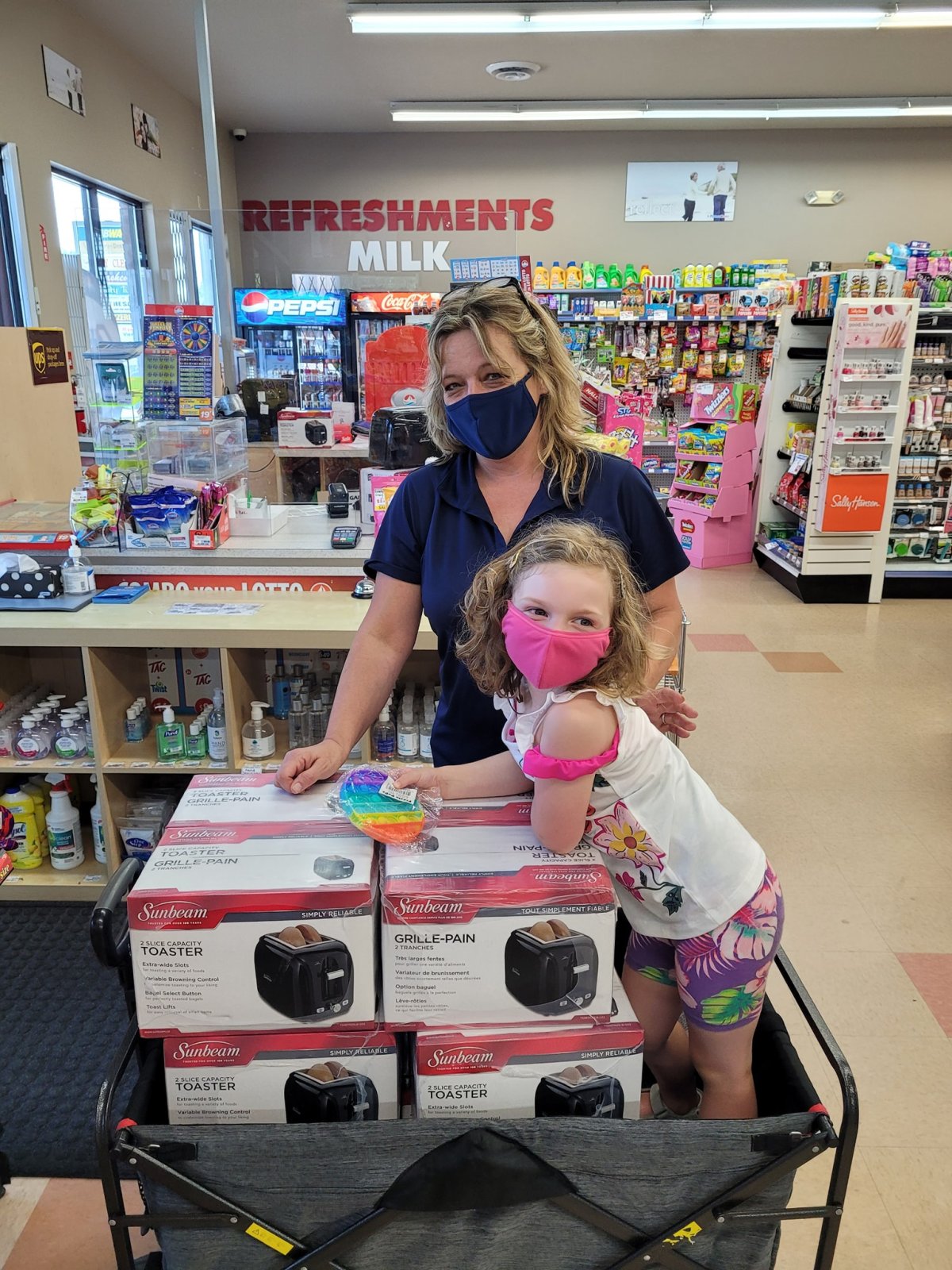 Waverley Road Pharmachoice store manager Betty Swaffer with the daughter of Nora Lindner, who bought 12 toasters to donate.