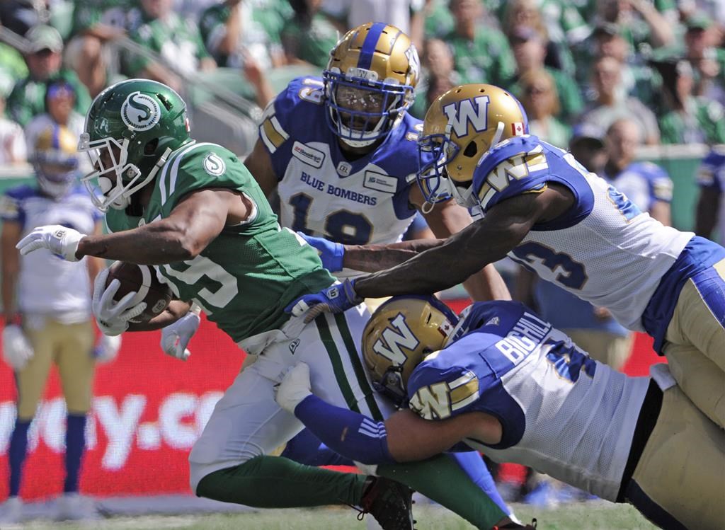 Saskatchewan Roughriders running back William Powell fights for yards during first half CFL action against the Winnipeg Blue Bombers, in Regina, Sunday, Sept. 1, 2019.