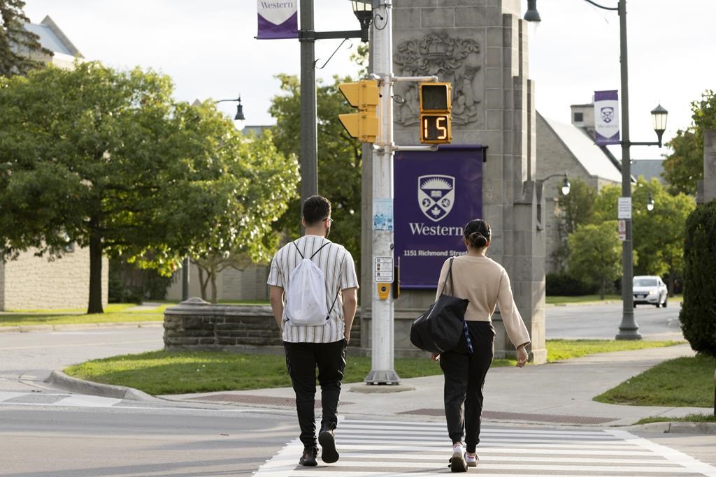 Students walk at the Western University campus