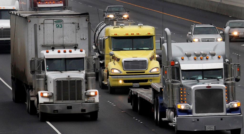 File photo of semi-tractor trailers on a highway.