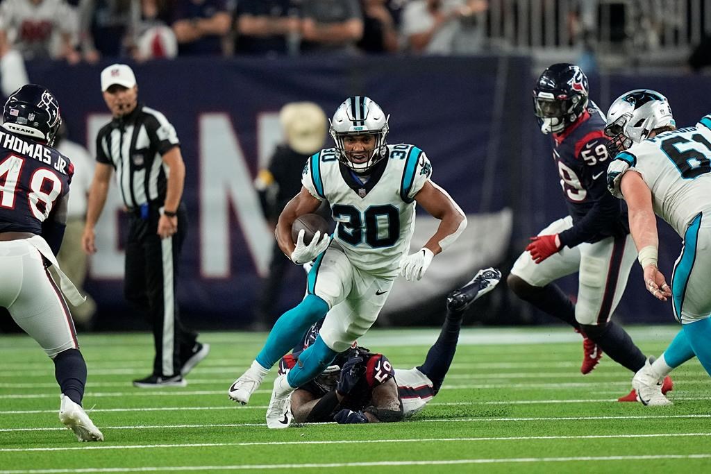 Carolina Panthers running back Chuba Hubbard (30) rushes for a gain against the Houston Texans during the second half of an NFL football game Thursday, Sept. 23, 2021, in Houston.