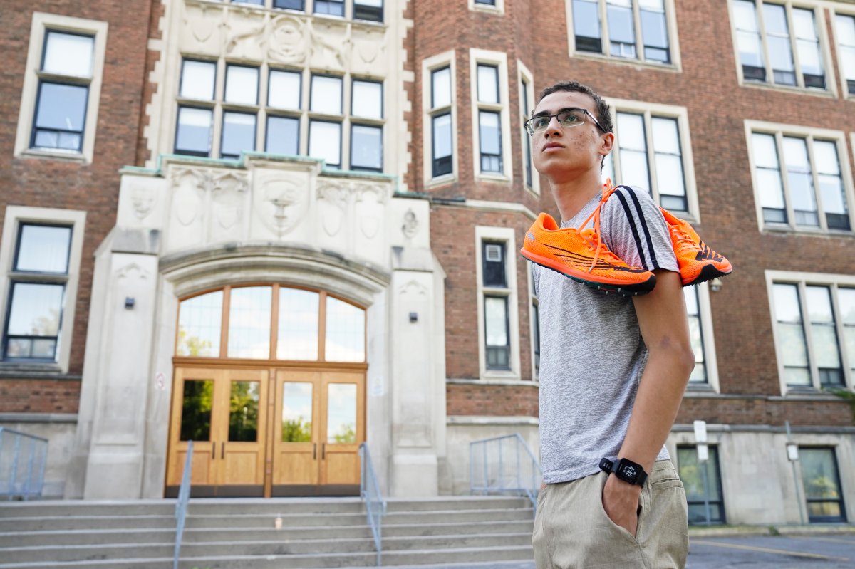 Oliver Waddington, 16, who is a senior high school student at Glebe Collegiate Institute, is pictured at the school in Ottawa, Not., on Tuesday, Aug 31, 2021. Waddington, who competes in cross-country and track and field, is disappointed in the school board's decision to pause extracurriculars. 