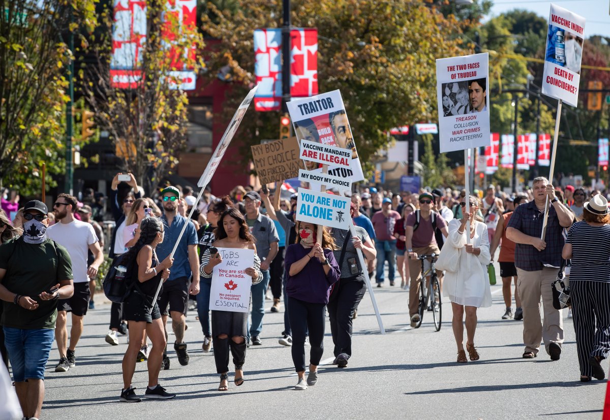 People march during a protest against COVID-19 vaccine passports and mandatory vaccinations for healthcare workers, in Vancouver, on Wednesday, September 1, 2021. A similar protest was held in Winnipeg Wednesday outside the Health Sciences Centre.