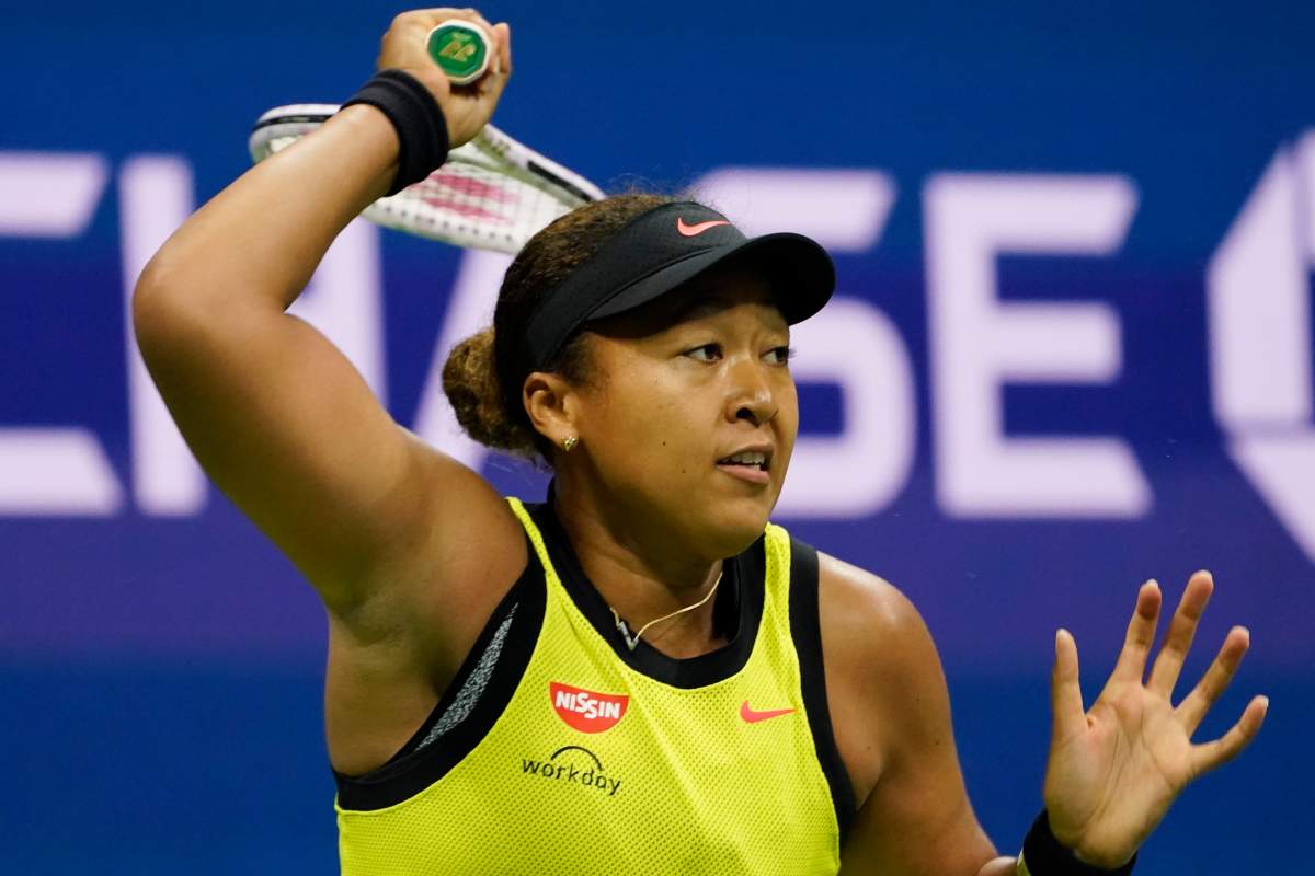 Naomi Osaka, of Japan, returns a shot to Leylah Fernandez, of Canada, during the third round of the US Open tennis championships, Friday, Sept. 3, 2021, in New York. (AP Photo/John Minchillo).