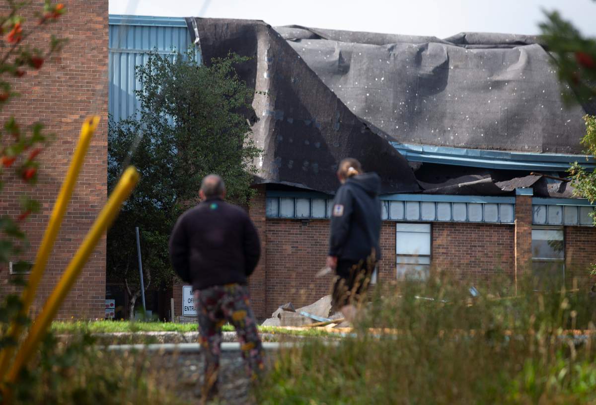 The roof of Mary Queen of Peace elementary school was torn off after Hurricane Larry crossed over Newfoundland's Avalon Peninsula in the early morning hours, in St. John's, Saturday, Sept. 11, 2021. THE CANADIAN PRESS/Paul Daly.