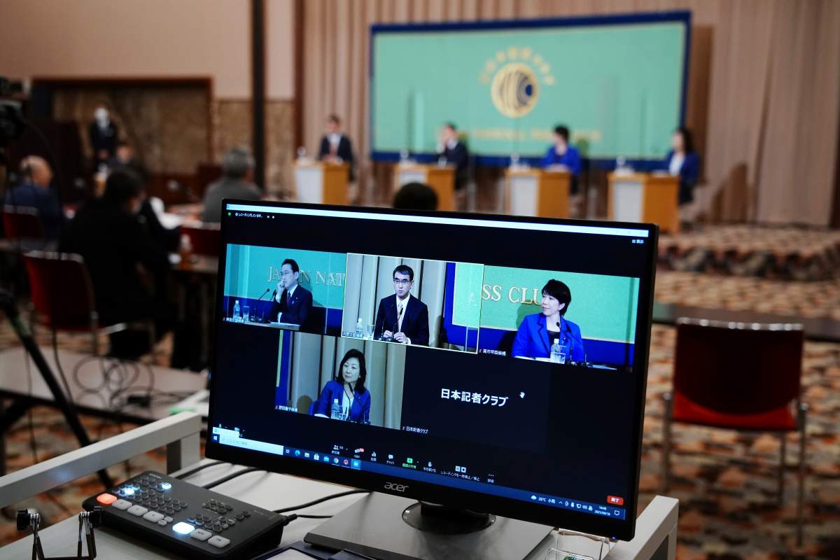 A computer monitor shows the live streaming of the candidates for the presidential election of the ruling Liberal Democratic Party speaking at a debate session hosted by the Japan National Press Club Sept. 18, 2021 in Tokyo.