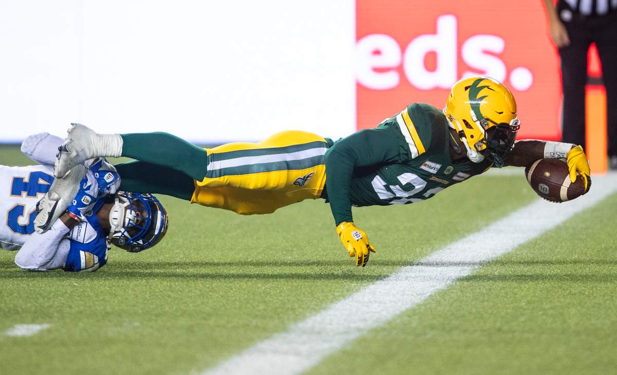 Winnipeg Blue Bombers’ DeAundre Alford (45) tries to stop Edmonton Elks’ James Wilder Jr. (32) as he dives for the touchdown during second half CFL action in Edmonton, Alta., on Saturday September 18, 2021.