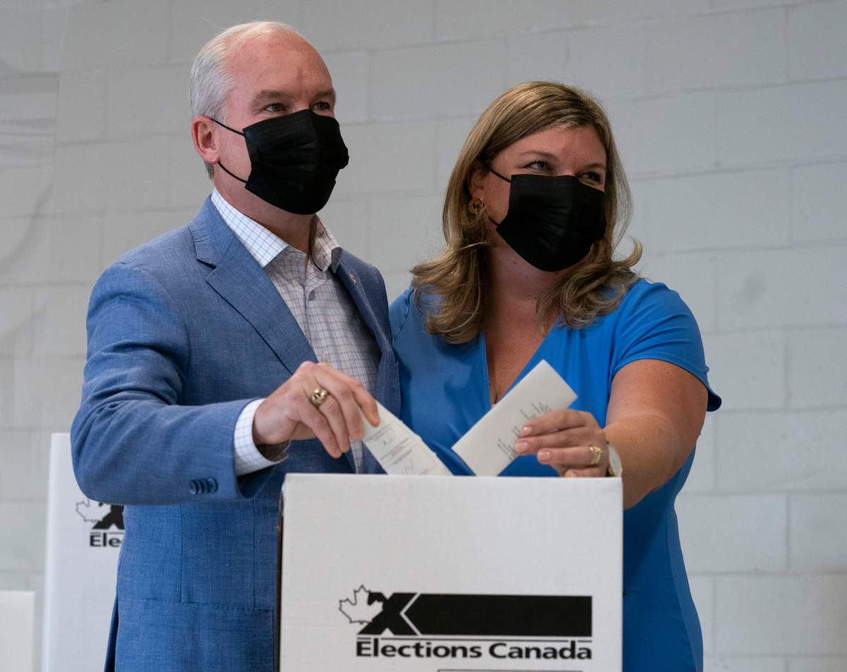 Conservative leader Erin O’Toole and Rebecca O’Toole cast their ballots in the federal election Monday, Sept. 20, 2021 in Bowmanville, Ont.