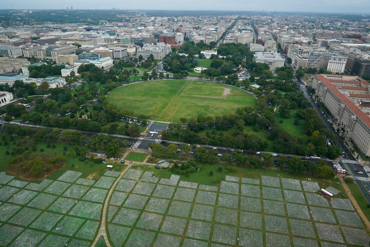 White flags that are part of artist Suzanne Brennan Firstenberg’s “In America: Remember,” a temporary art installation to commemorate Americans who have died of COVID-19, stand on the National Mall in Washington, Wednesday, Sept. 22, 2021. (AP Photo/Patrick Semansky)