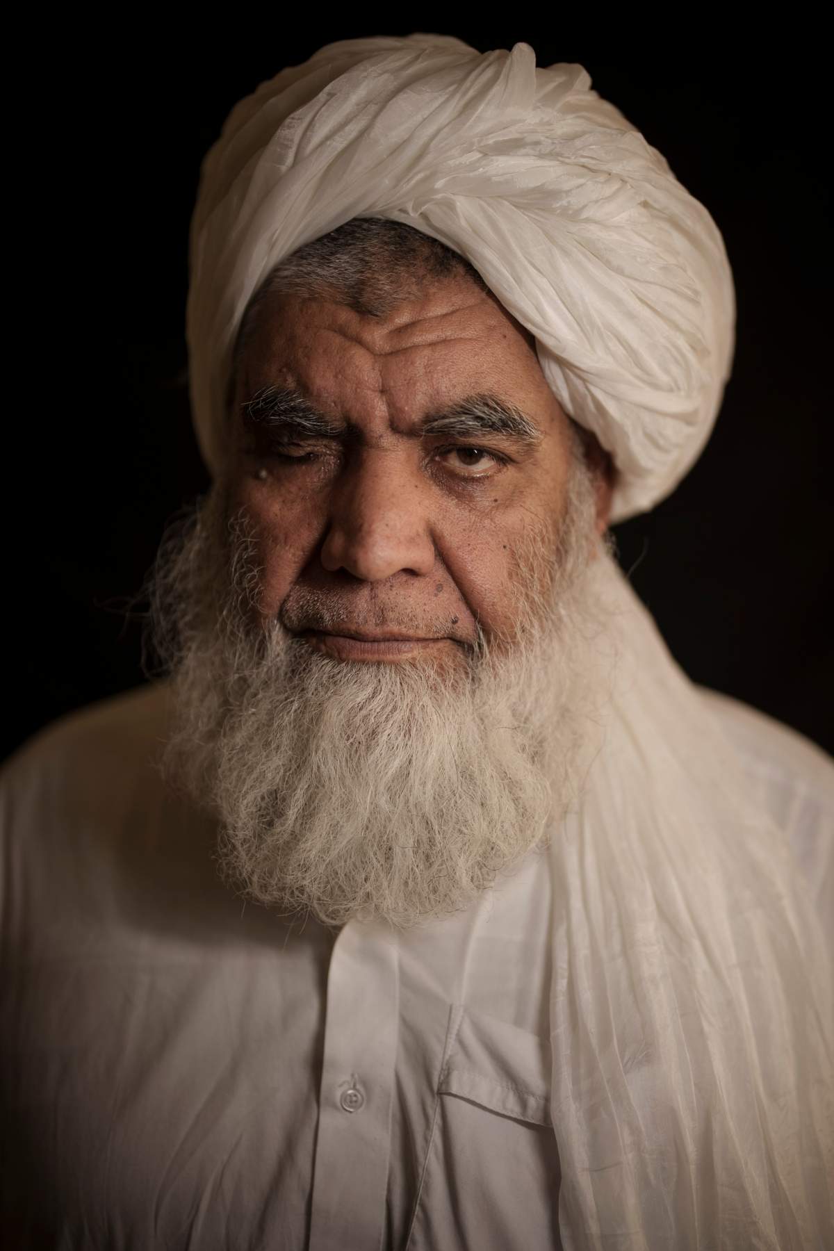 Taliban leader Mullah Nooruddin Turabi poses for a photo in Kabul, Afghanistan, Wednesday, Sept. 22, 2021.