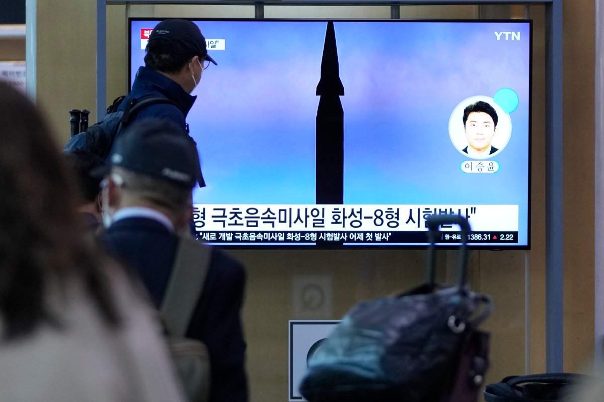 People watch a TV screen showing a news program reporting about North Korea's missile launch at a train station in Seoul, South Korea, Wednesday, Sept. 29, 2021.