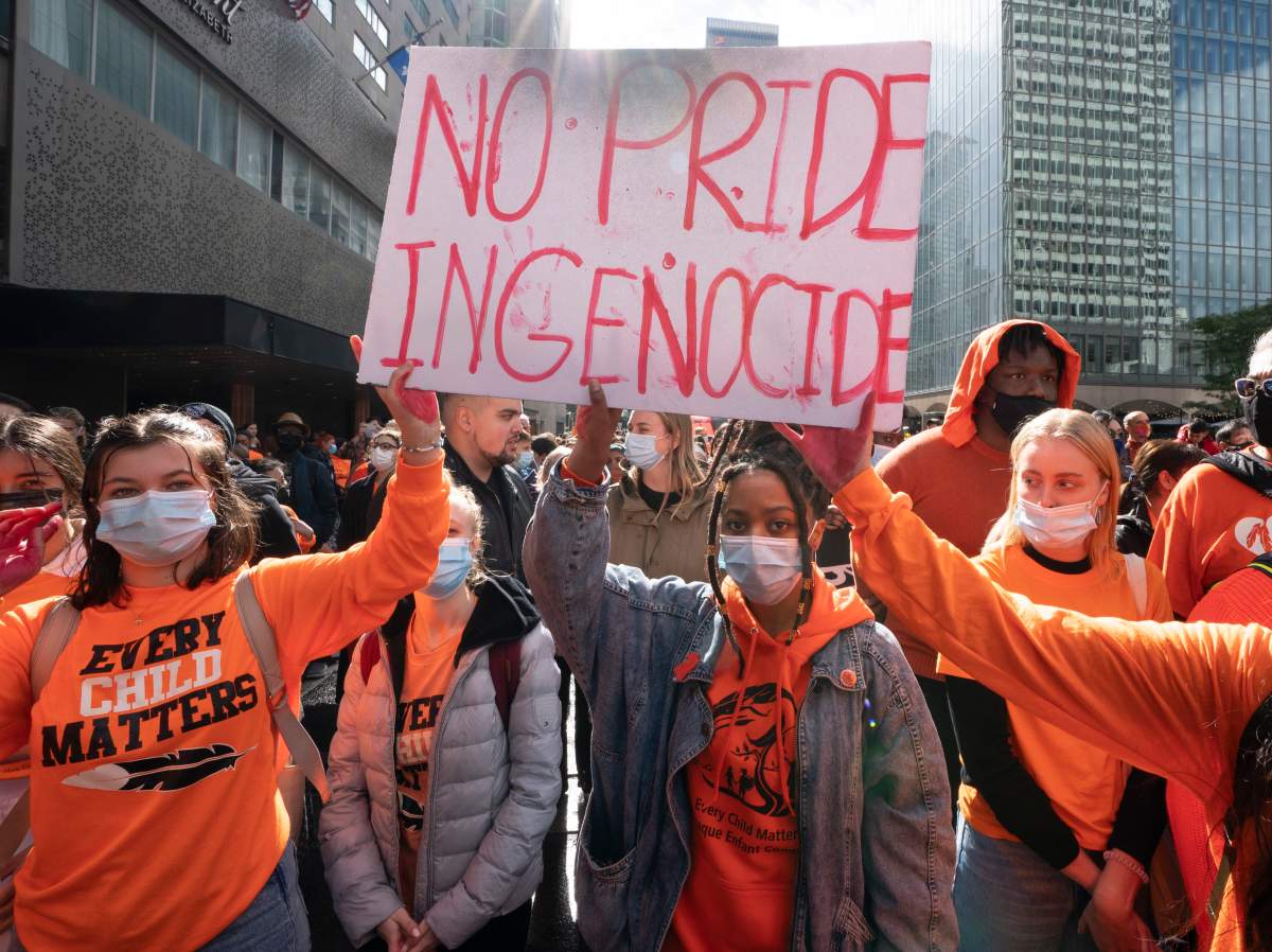 People take part in a march to mark the first National Day for Truth and Reconciliation Thursday, Sept. 30, 2021 in Montreal.