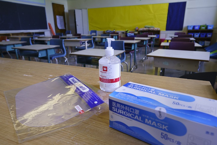 Personal protection equipment is seen on the teacher's desk in classroom in preparation for the new school year at the Willingdon Elementary School in Montreal, on Wednesday, August 26, 2020. 