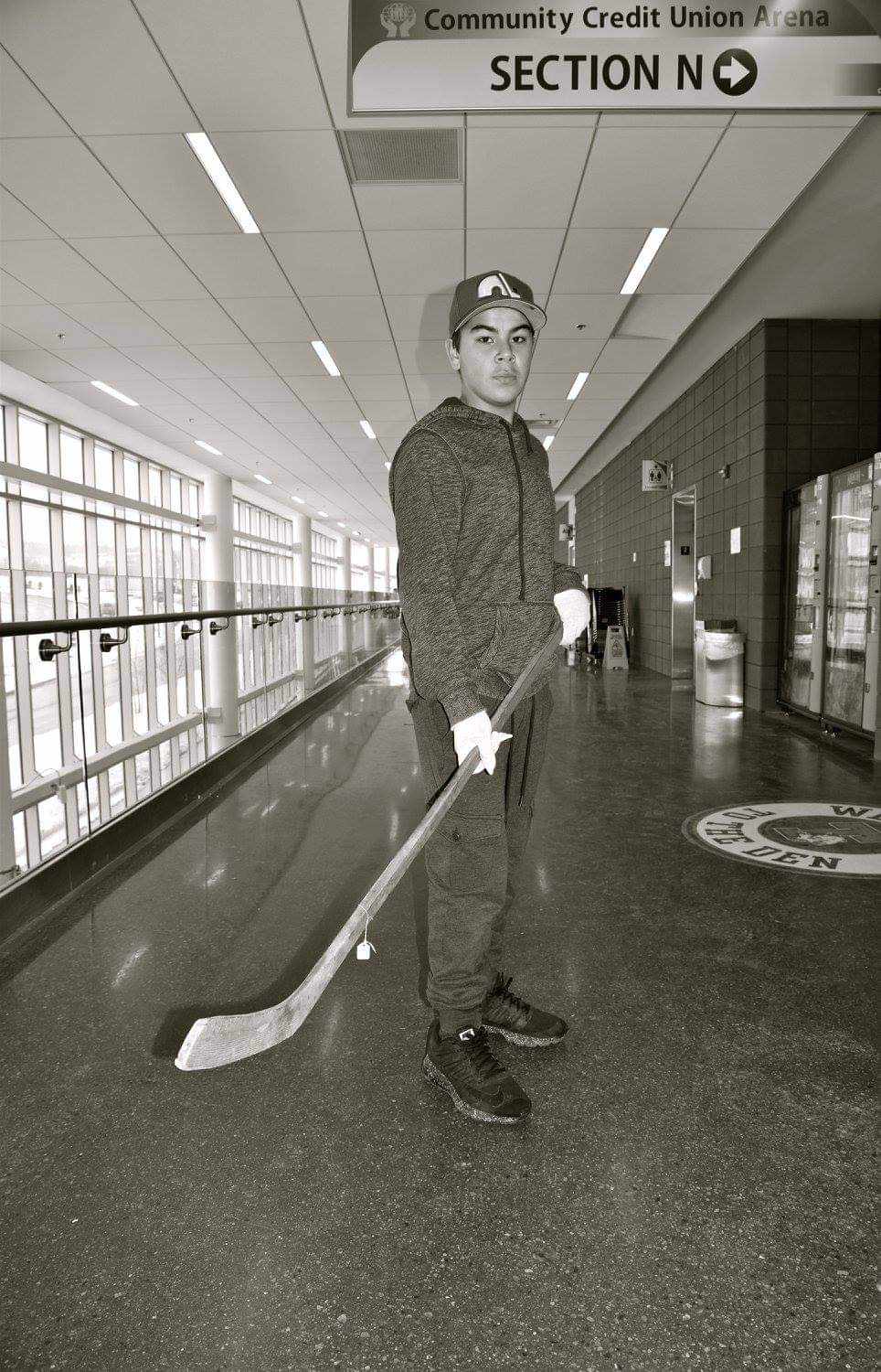 Cheryl Maloney’s son Chase, poses with a 1917 stick, handmade by his great, great grandfather, Alexander Cope.