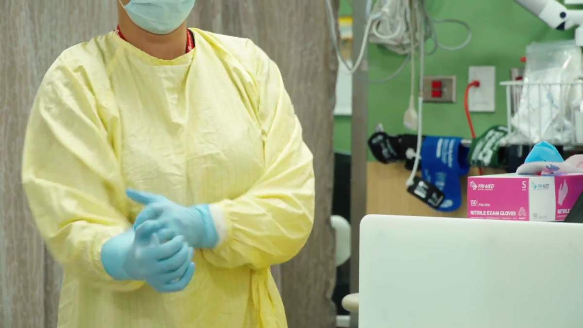 Staff donning PPE at the Royal Alexandra Hospital in Edmonton, Alta. in September 2021.