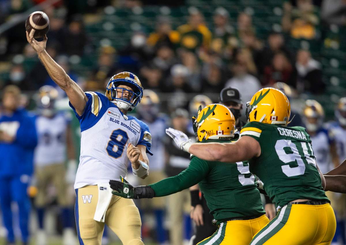 Winnipeg Blue Bombers quarterback  Zach Collaros (8) makes the throw against the Edmonton Elks during first half CFL action in Edmonton, Alta., on Saturday, September 18, 2021.