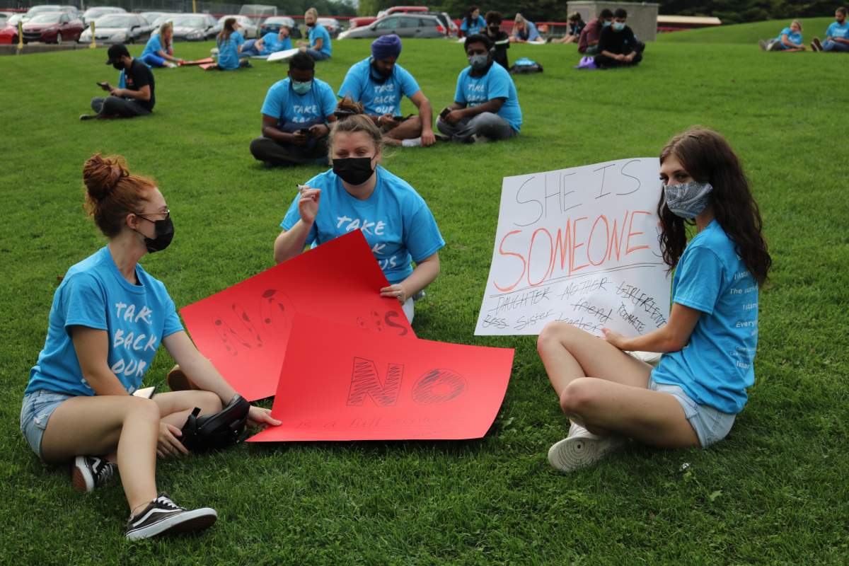 Fanshawe students decorating signs to protest sexual and gender based violence on campus on Sep. 20, 2021