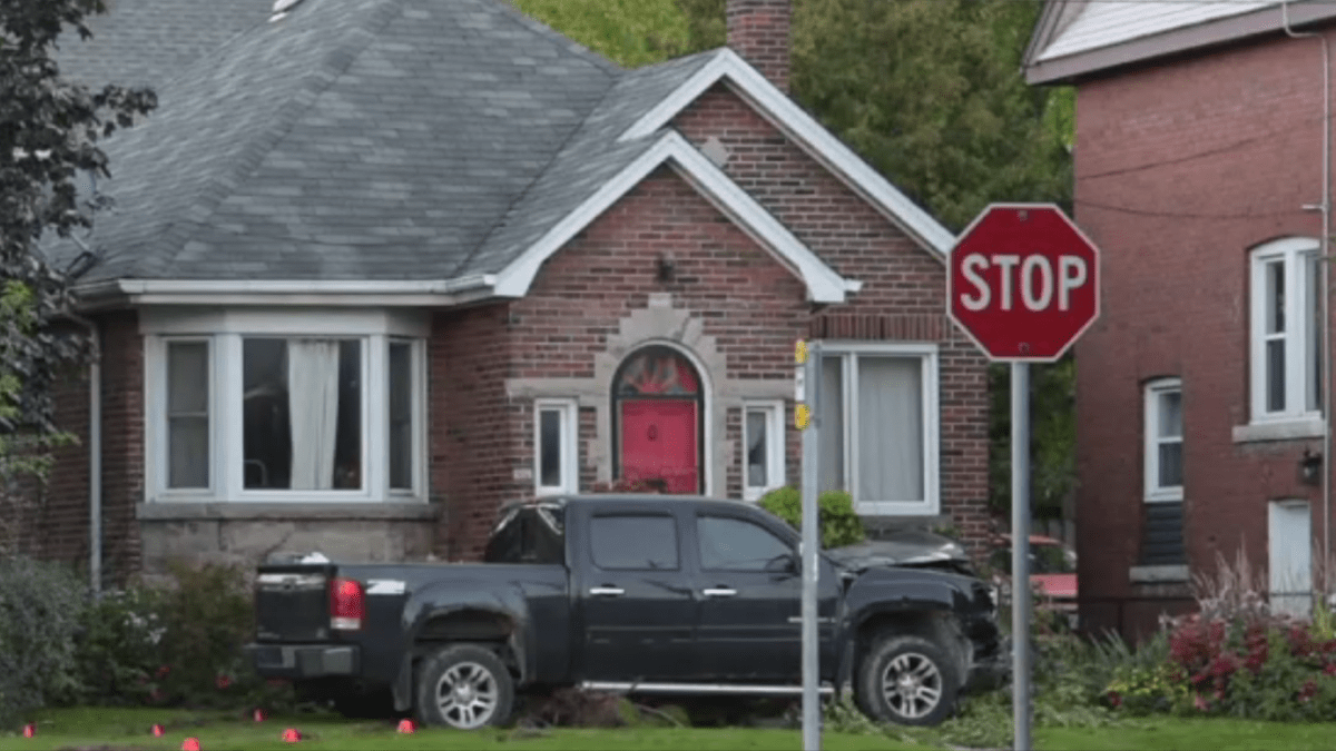 Police say a black GMC truck was driven by a suspect who drove through a stop sign before hitting a sedan with a 51-year old Hamilton woman near Maplewood Avenue and Balsam Avenue South.