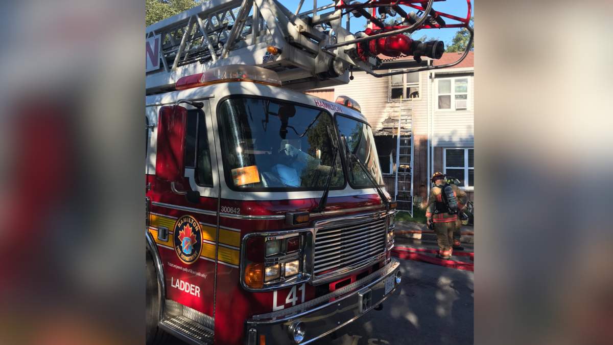 Hamilton firefighters knock down a blaze at a Stone Church Road town house on Sept. 10, 2021.