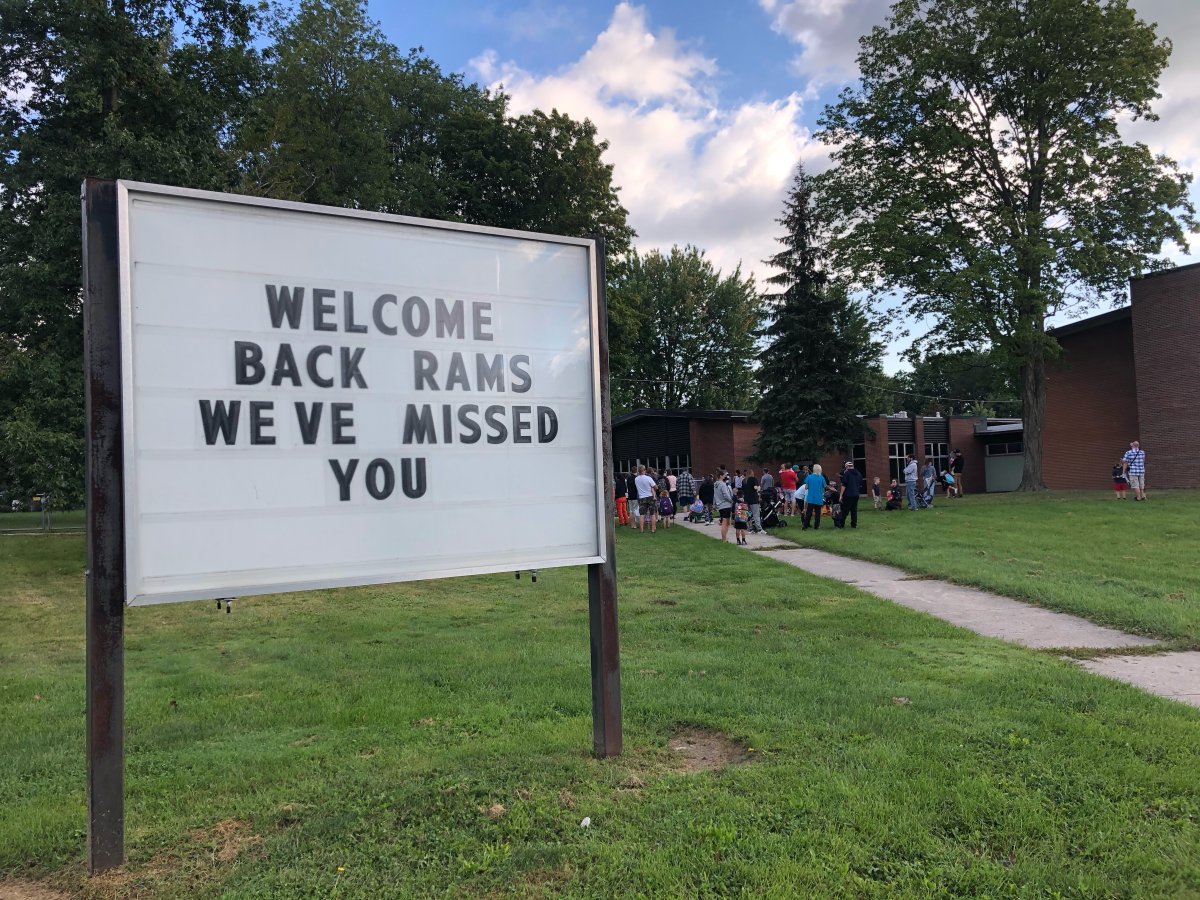 Students at John P. Robarts Public School in east London, Ont., line up outside ahead of the first day of classes for the 2021-2022 academic year.