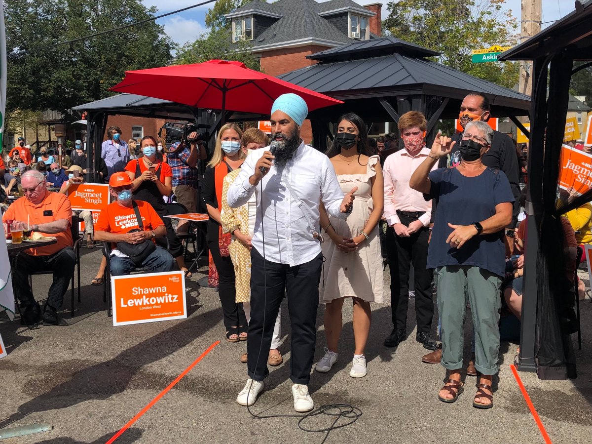 NDP Leader Jagmeet Singh greets a crowd of supporters at the Sweet Onion Bistro in London, Ont., during a campaign stop in the city's Wortley Village neighbourhood.