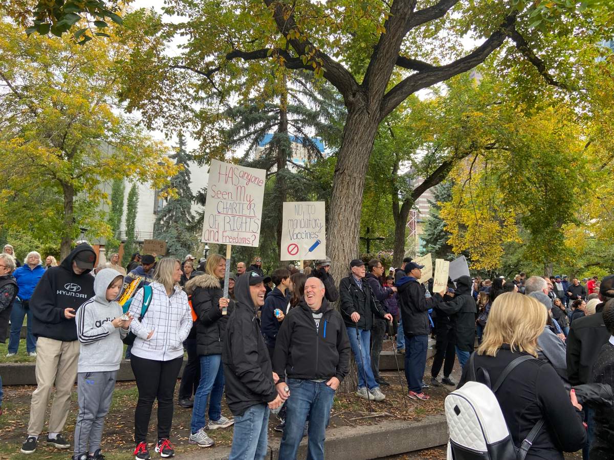 Protesters opposed to mandatory vaccinations gather at Olympic Plaza on Sunday, Sept. 12, 2021.