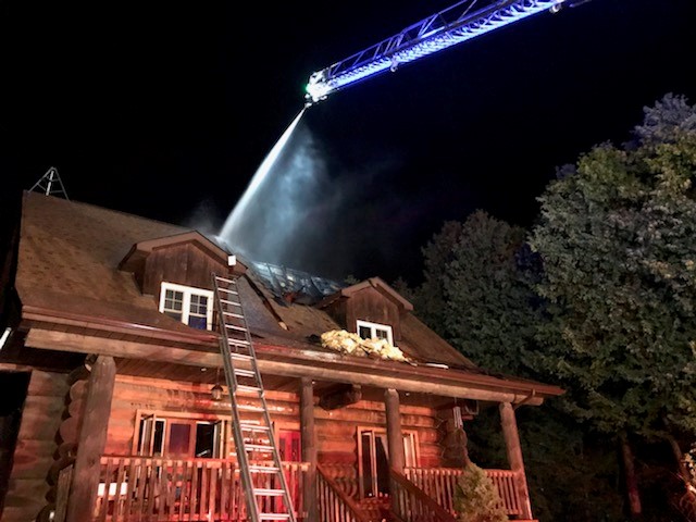 Ottawa fire crews took an aerial tact to douse flames in the roof of a log home on Iveson Road overnight.